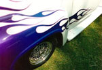 Full color photograph of Car with Blue flame designs